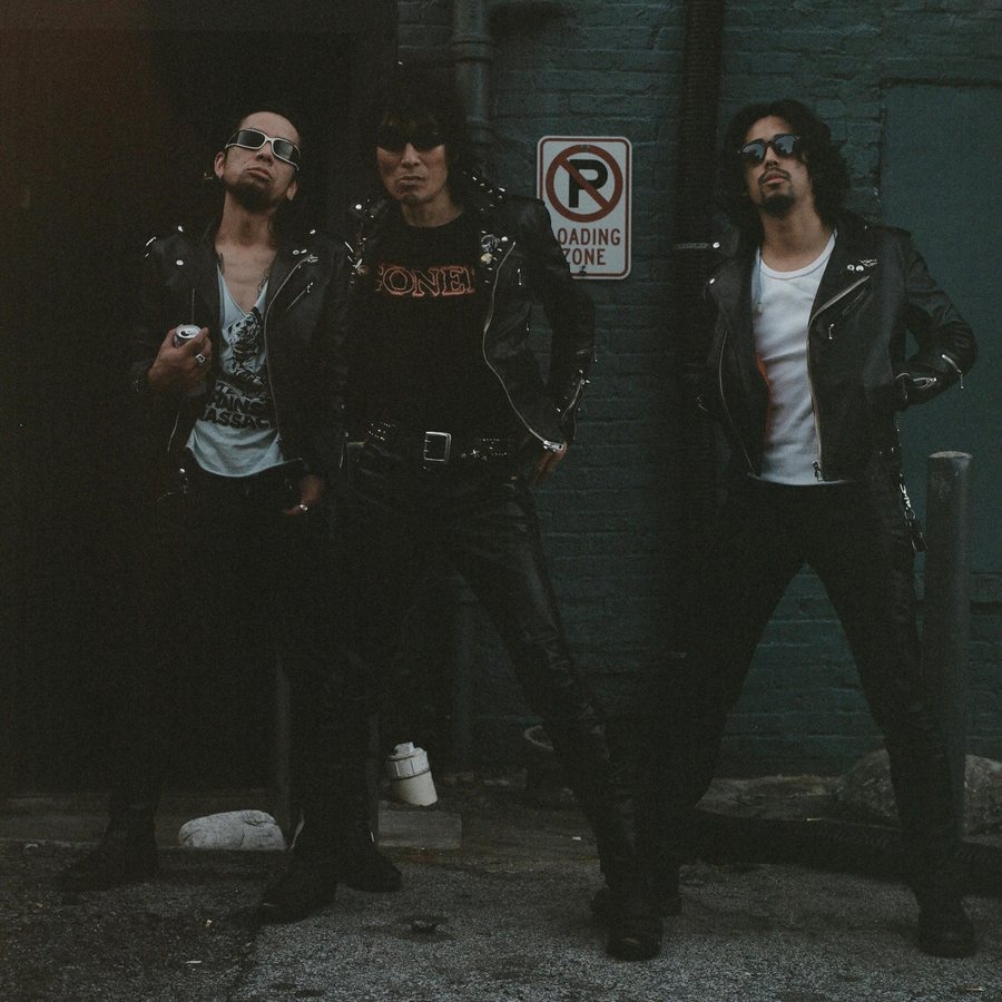 Guitar Wolf in leather jackets outside the 529 club, Atlanta, on medium format film