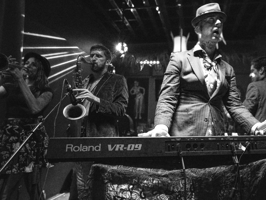Que Lastima on stage at Kreepy Tiki, saxophone and keys