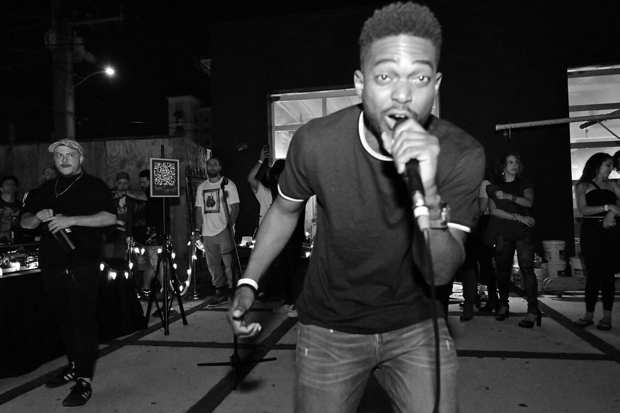 MC with microphone at Soundlab, Respectable Street, West Palm Beach